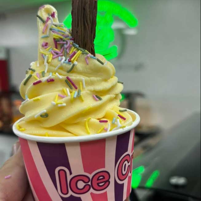 Honywood Sandwich Shop swirl of yellow soft-serve ice cream in a cup.