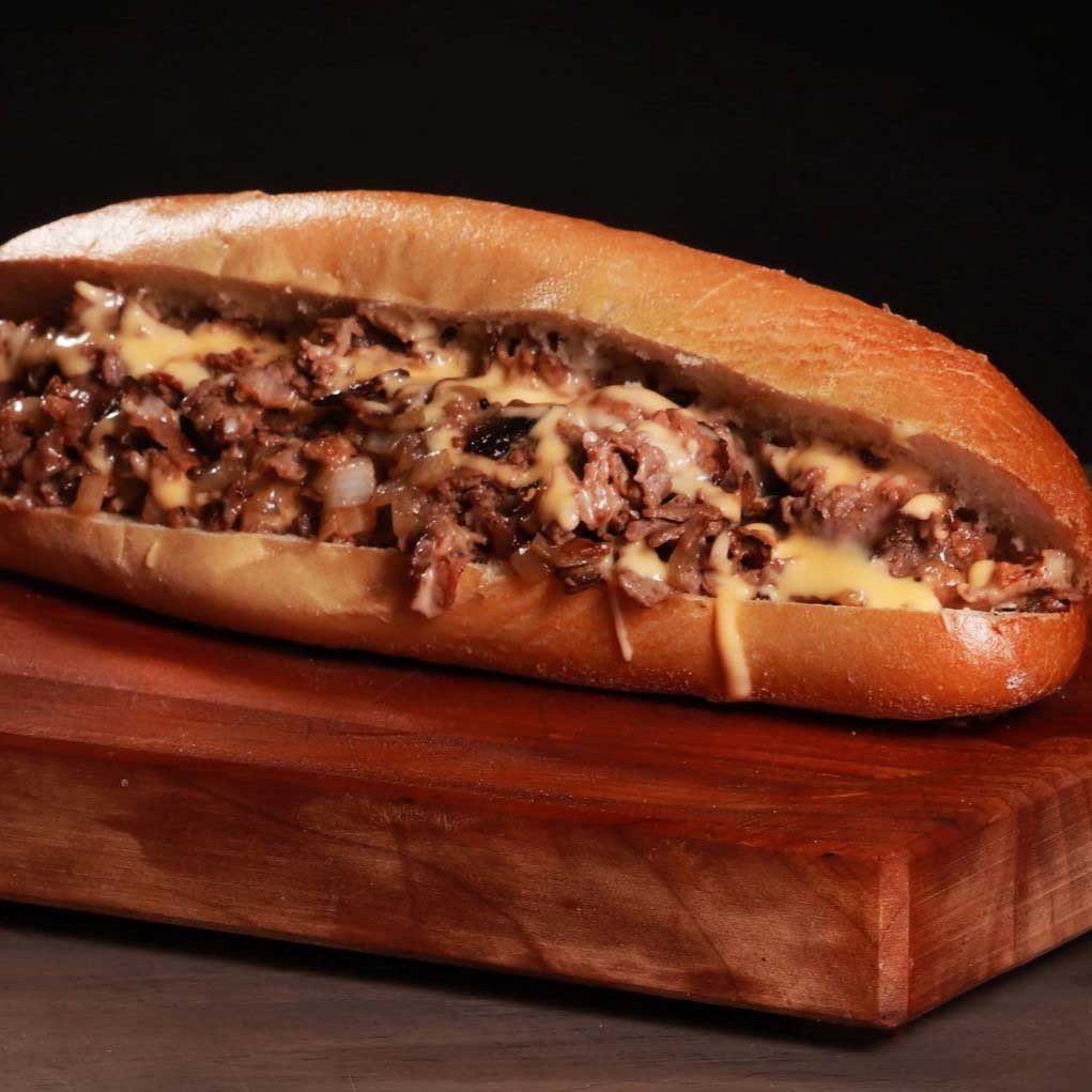 Honywood Sandwich Shop classic philly cheesesteak, shredded beef, onions and melted cheese on a sub.